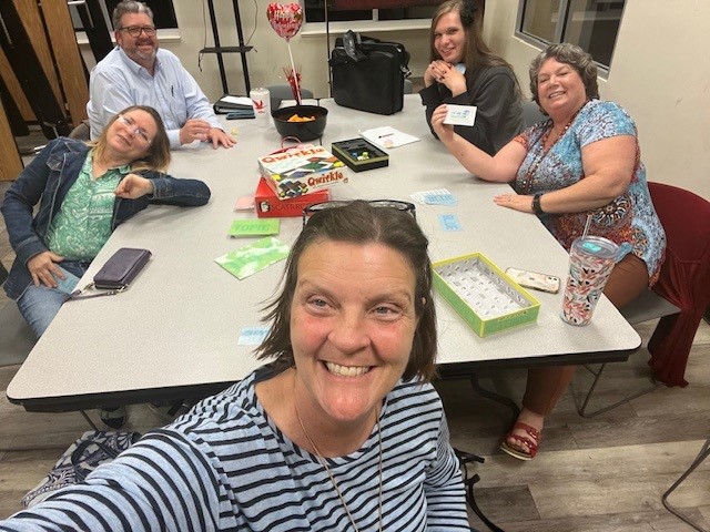 Members have a fun game night during a local PFLAG meeting.